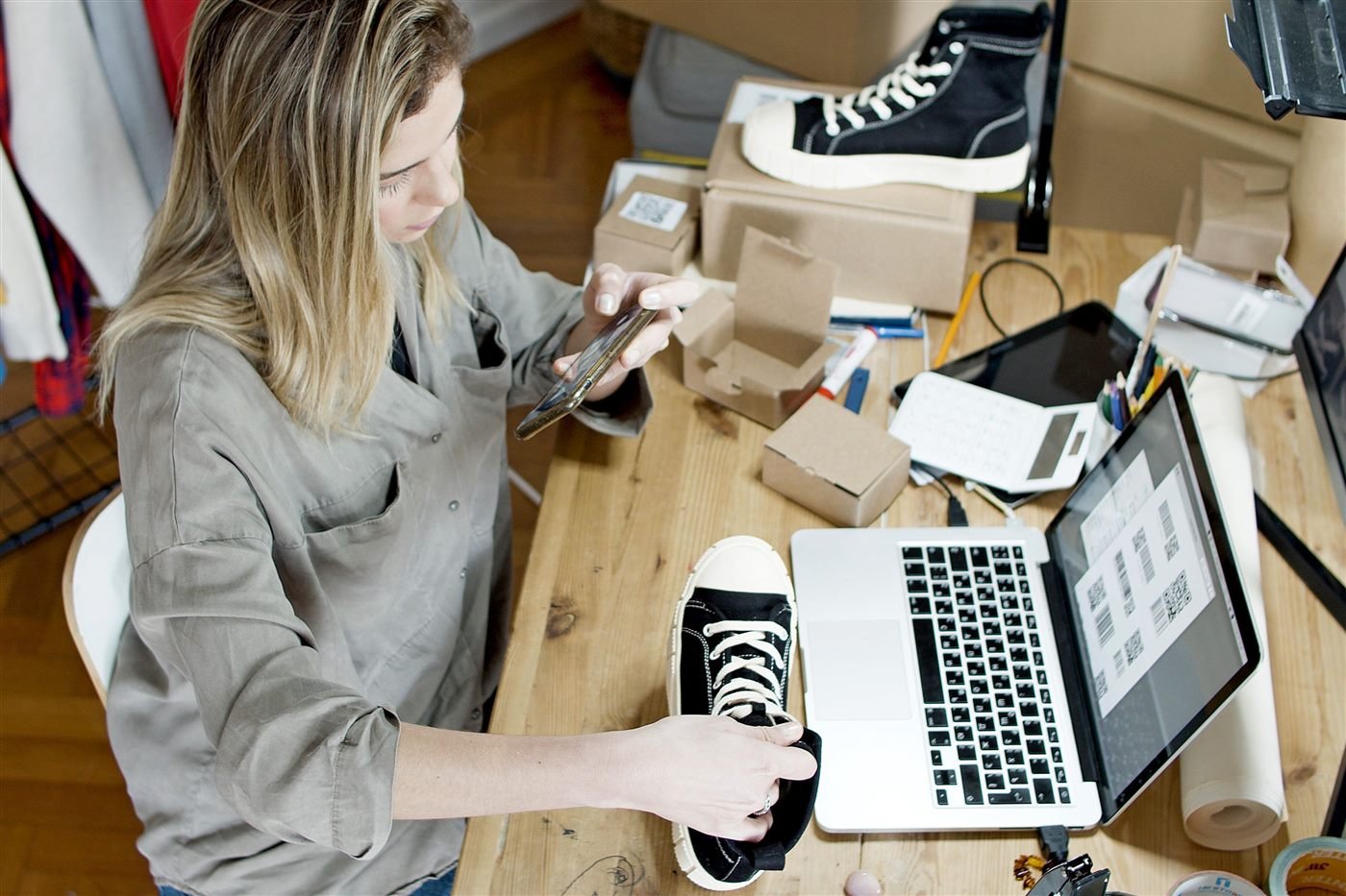 Online store owner packing an e-commerce order