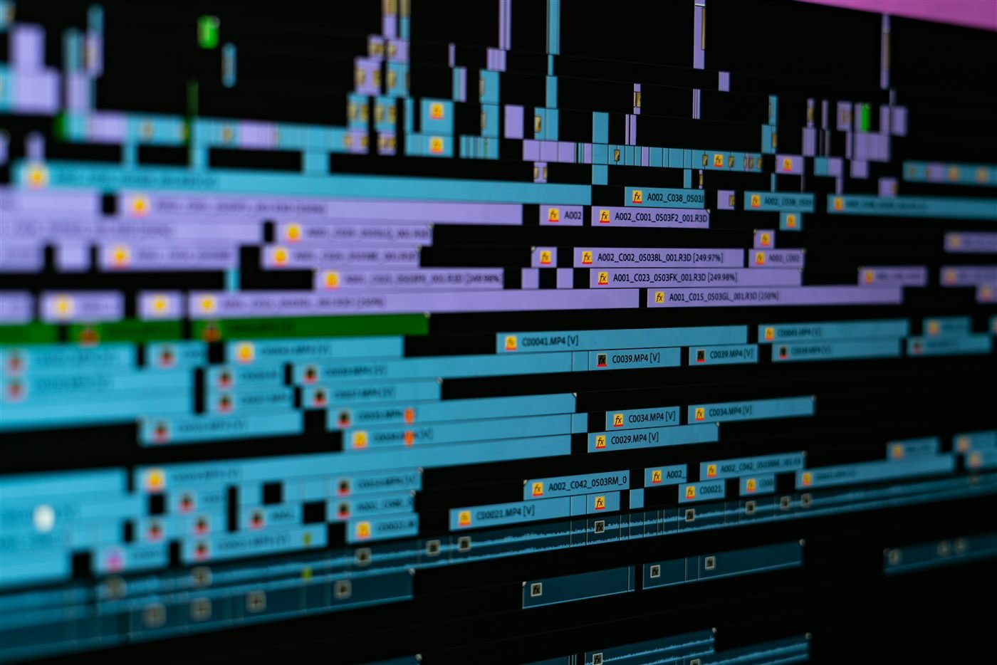 Video editor arranging clips on a digital timeline